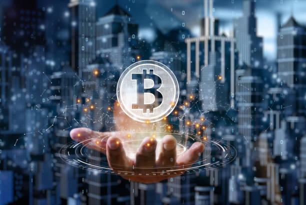 https://media.istockphoto.com/id/1313455188/photo/businessman-is-holding-a-bitcoin-as-part-of-a-business-network-cryptocurrency-blockchain.jpg?b=1&s=612x612&w=0&k=20&c=3VSBusP-hgIBad31TZDHv5DUNljaePvqJTeJqdTNAMU=